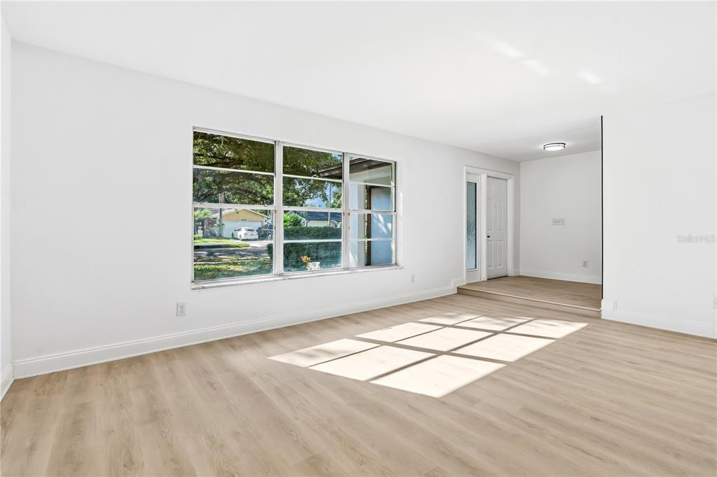 1985 Japonica Road Winter Park, FL 32792 - Photo 30 of 51 an empty room with wooden floor and windows