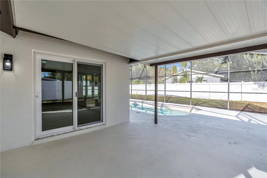 1985 Japonica Road Winter Park, FL 32792 - Photo 38 of 51 a view of an empty room with a sliding door