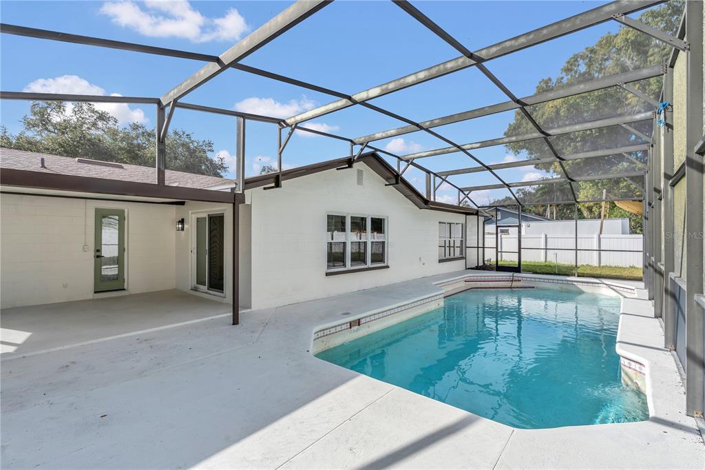 1985 Japonica Road Winter Park, FL 32792 - Photo 40 of 51 a view of a house with a swimming pool