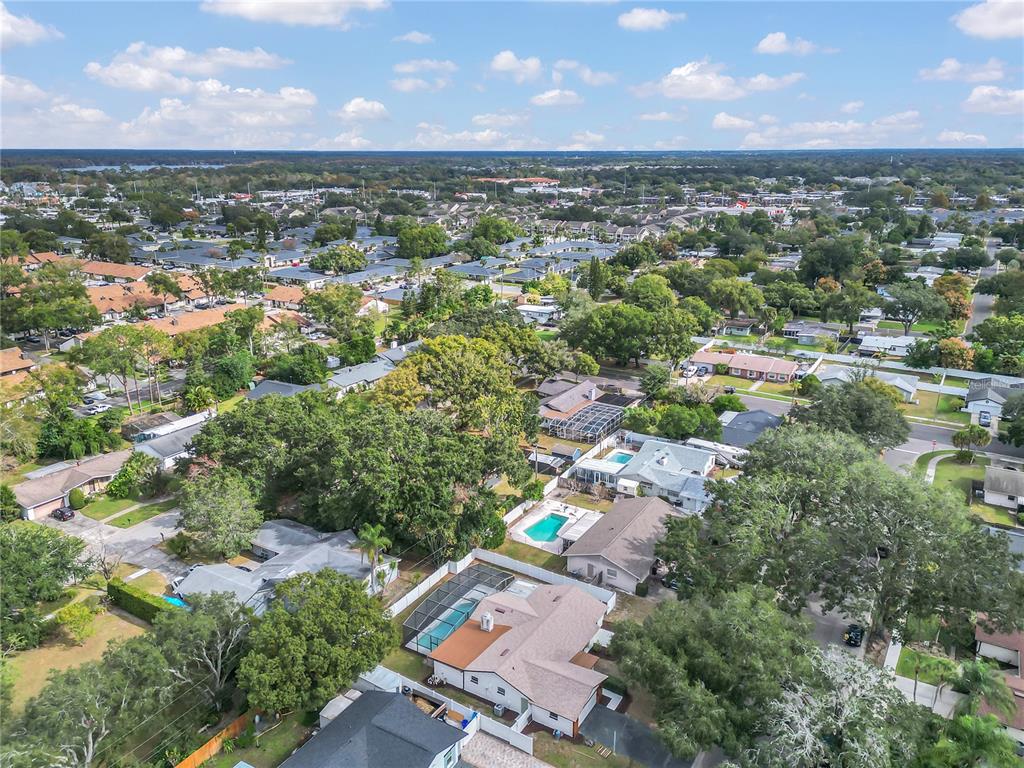 1985 Japonica Road Winter Park, FL 32792 - Photo 45 of 51 an aerial view of residential houses with outdoor space and a lake view