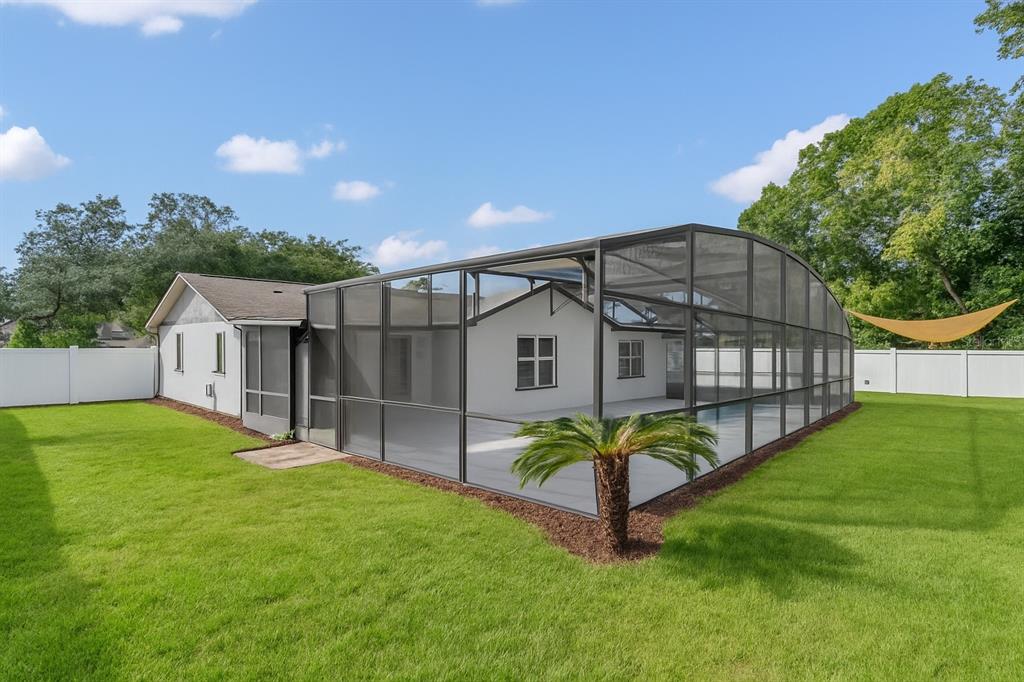 1985 Japonica Road Winter Park, FL 32792 - Photo 5 of 51 a view of backyard with small cabin and wooden fence