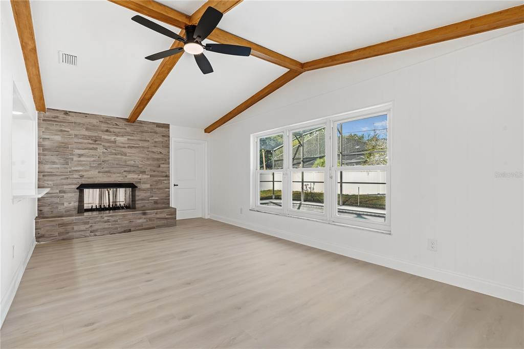 1985 Japonica Road Winter Park, FL 32792 - Photo 10 of 51 an empty room with windows and fan