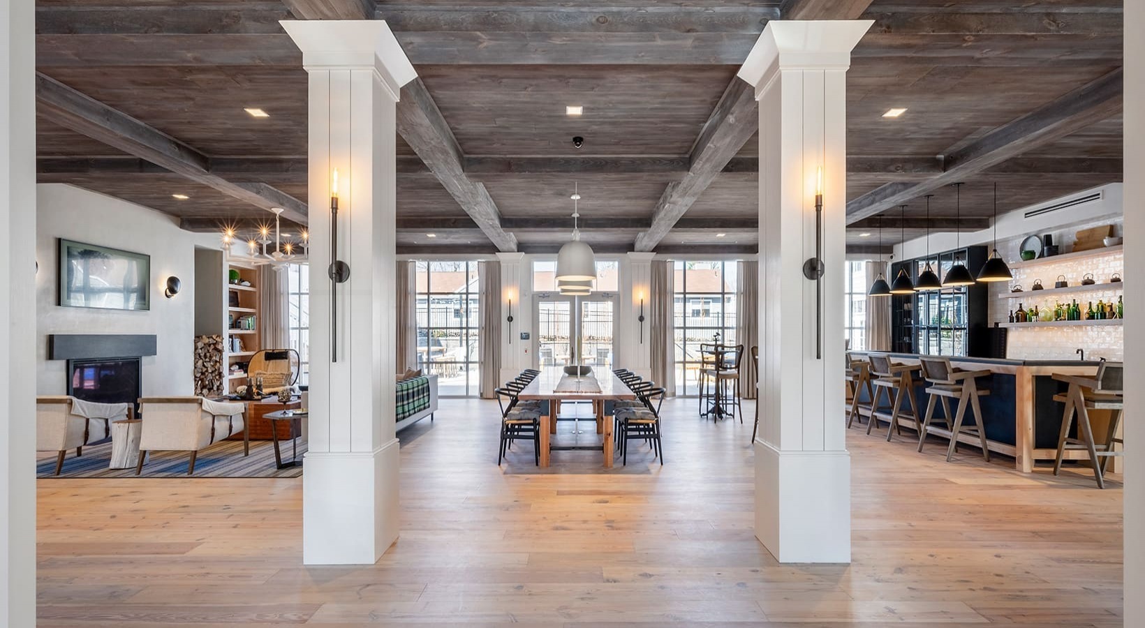 a view of a big room with furniture wooden floor and windows