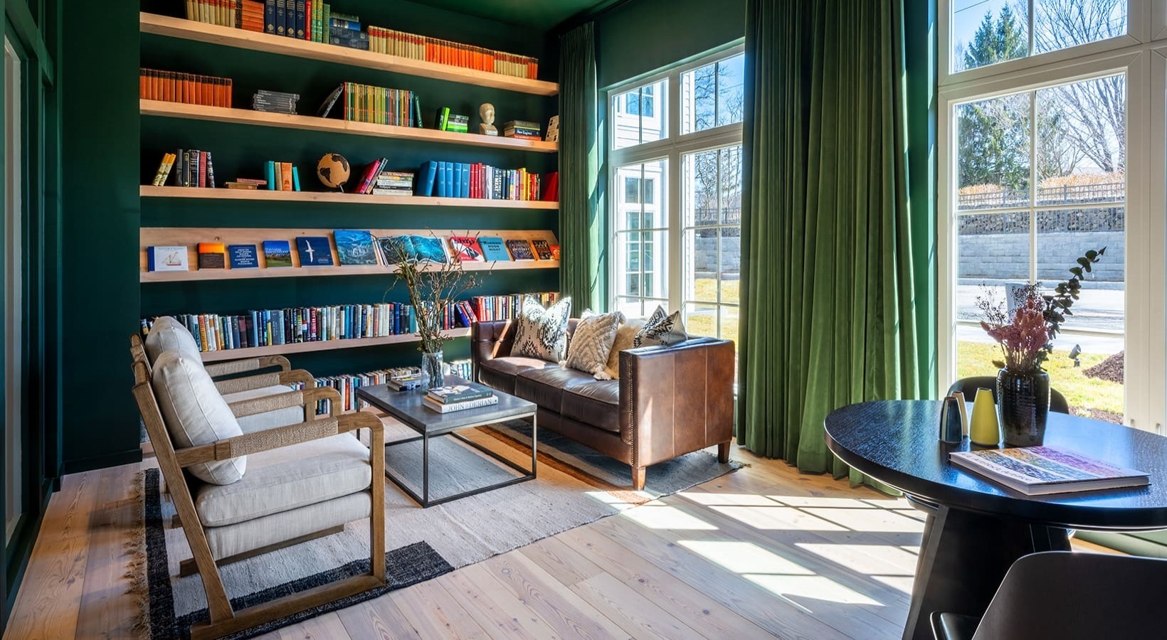333 Unquowa Road, Unit 324 Fairfield, CT 06824 - Photo 5 of 12 a living room with furniture and a book shelf