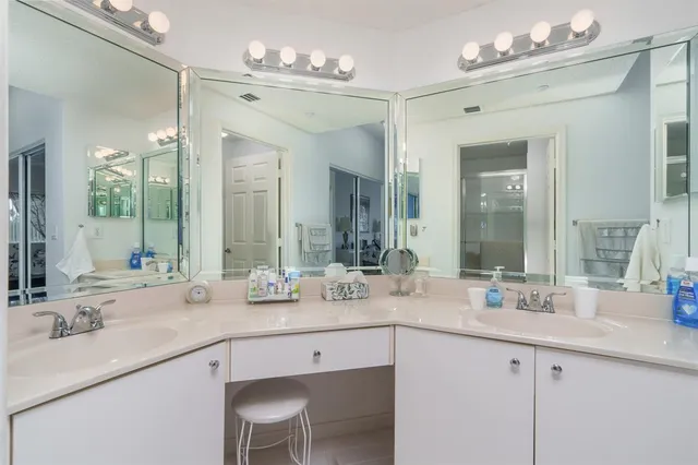 a bathroom with a sink double vanity and a mirror