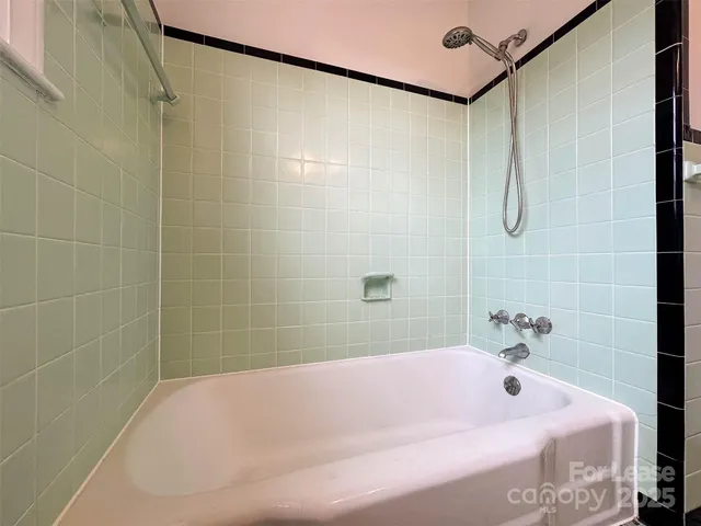a bathroom with a bath tub