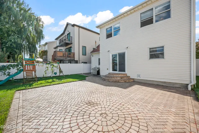 a view of a backyard with potted plants