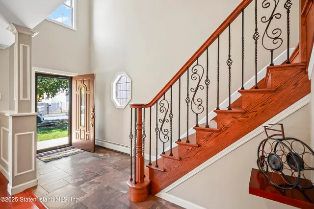 a view of an entryway with wooden floor