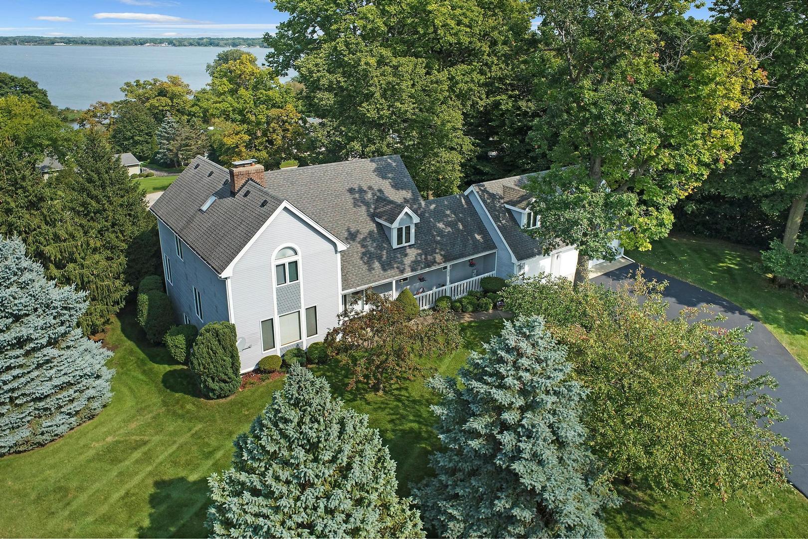 a view of a house with a yard and plants