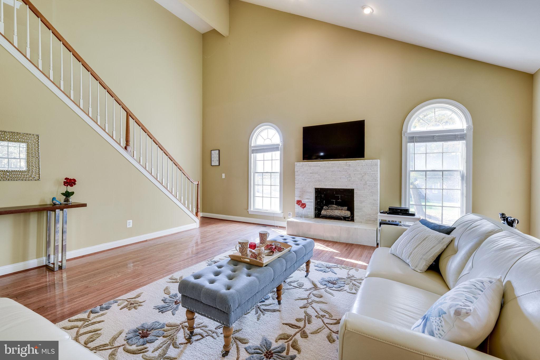 1701 Raleigh Hill Road Vienna, VA 22182 - Photo 11 of 61 a living room with furniture fireplace and a flat screen tv