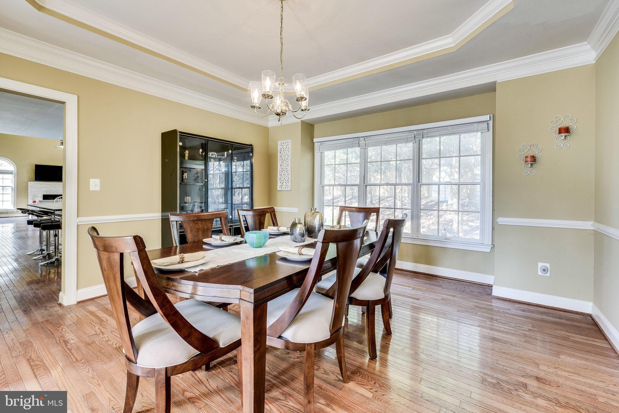 1701 Raleigh Hill Road Vienna, VA 22182 - Photo 23 of 61 a view of a dining room with furniture window and wooden floor