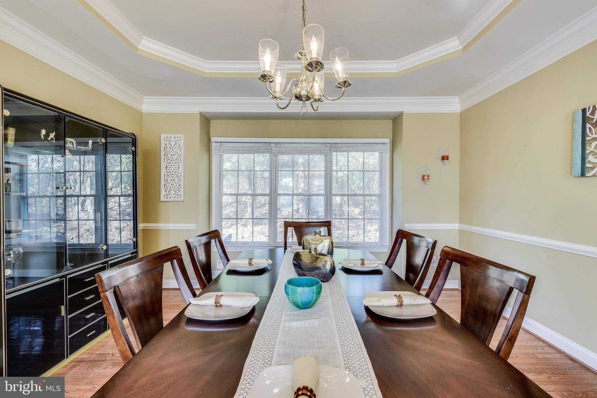 1701 Raleigh Hill Road Vienna, VA 22182 - Photo 26 of 61 a living room with furniture and a chandelier