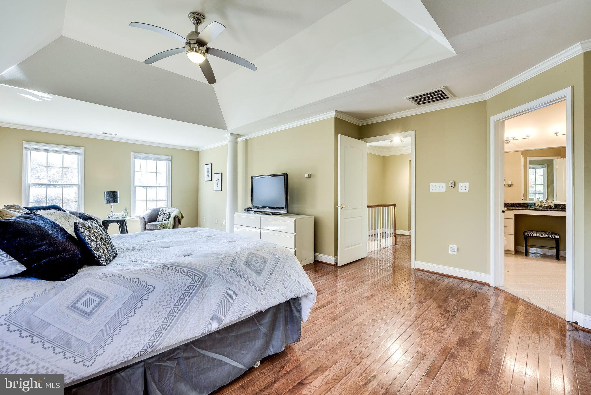 1701 Raleigh Hill Road Vienna, VA 22182 - Photo 33 of 61 a large bedroom with a bed and wooden floor