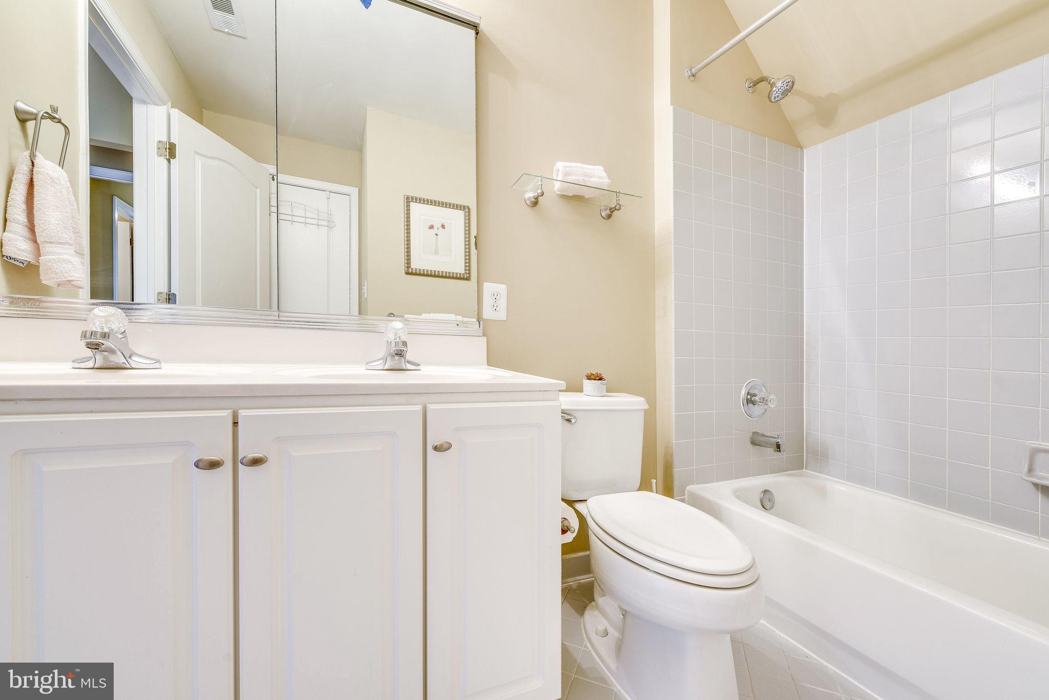 1701 Raleigh Hill Road Vienna, VA 22182 - Photo 39 of 61 a bathroom with a sink a toilet and shower