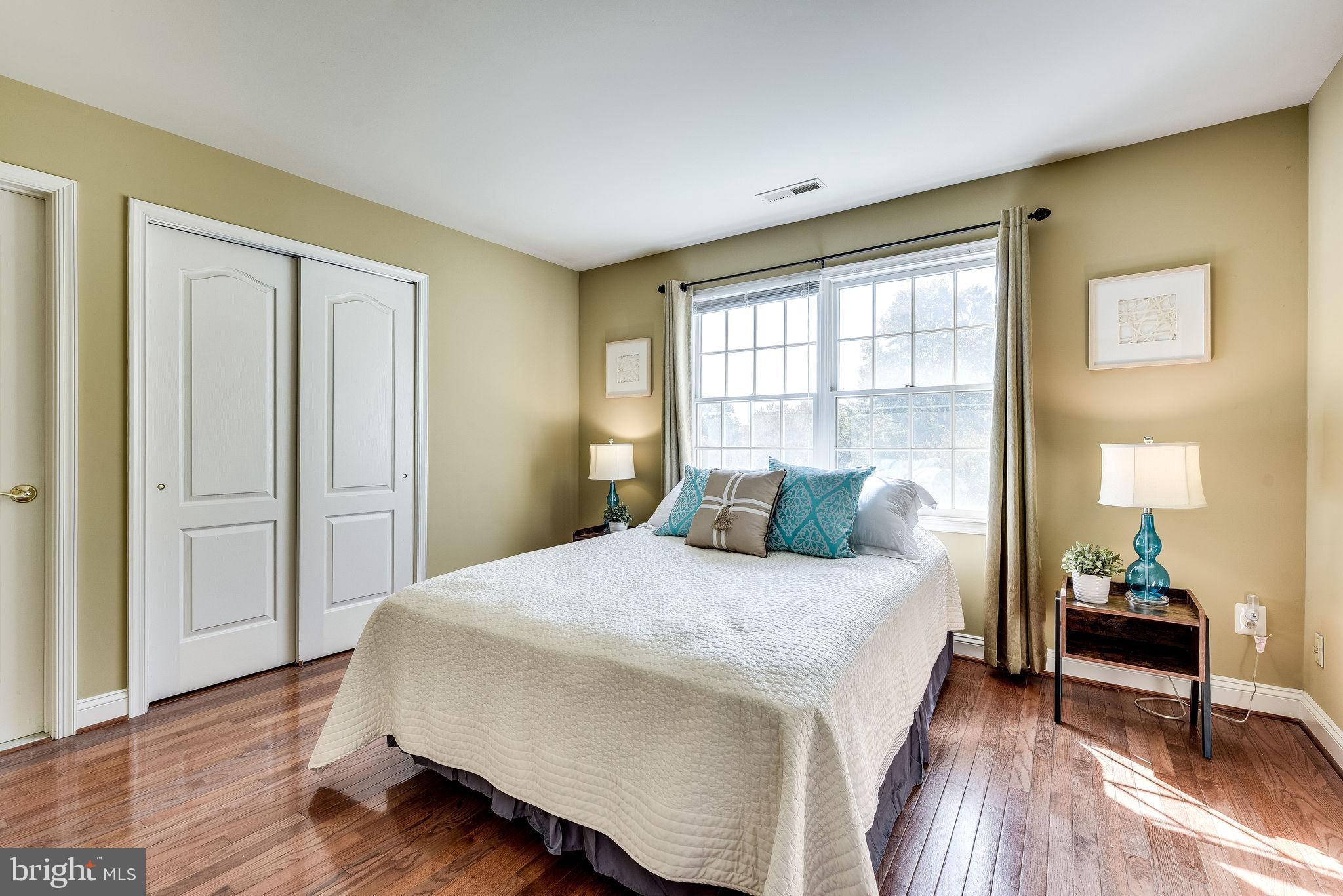 1701 Raleigh Hill Road Vienna, VA 22182 - Photo 41 of 61 a bedroom with a bed and wooden floor