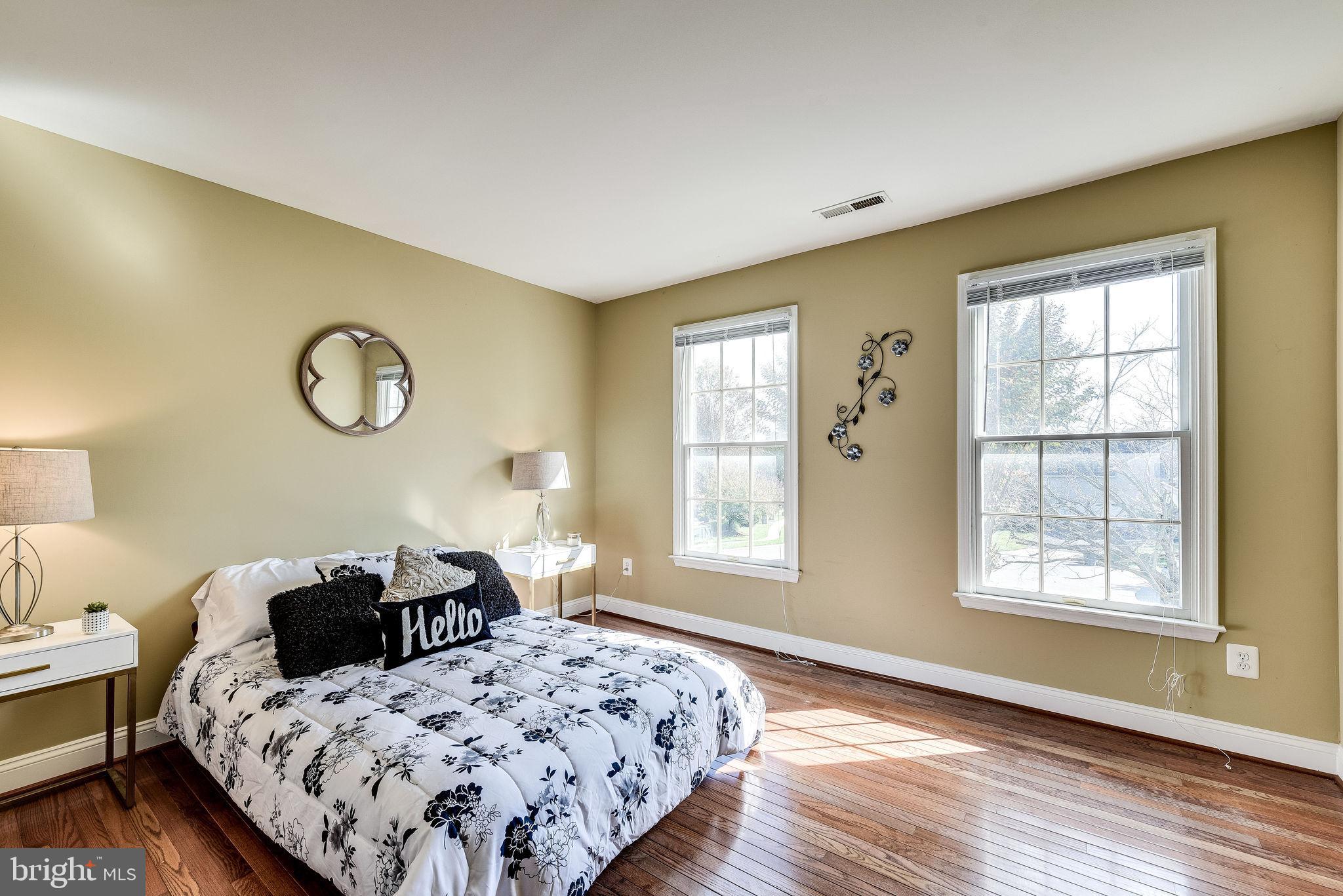 1701 Raleigh Hill Road Vienna, VA 22182 - Photo 43 of 61 a bedroom with a bed and wooden floor