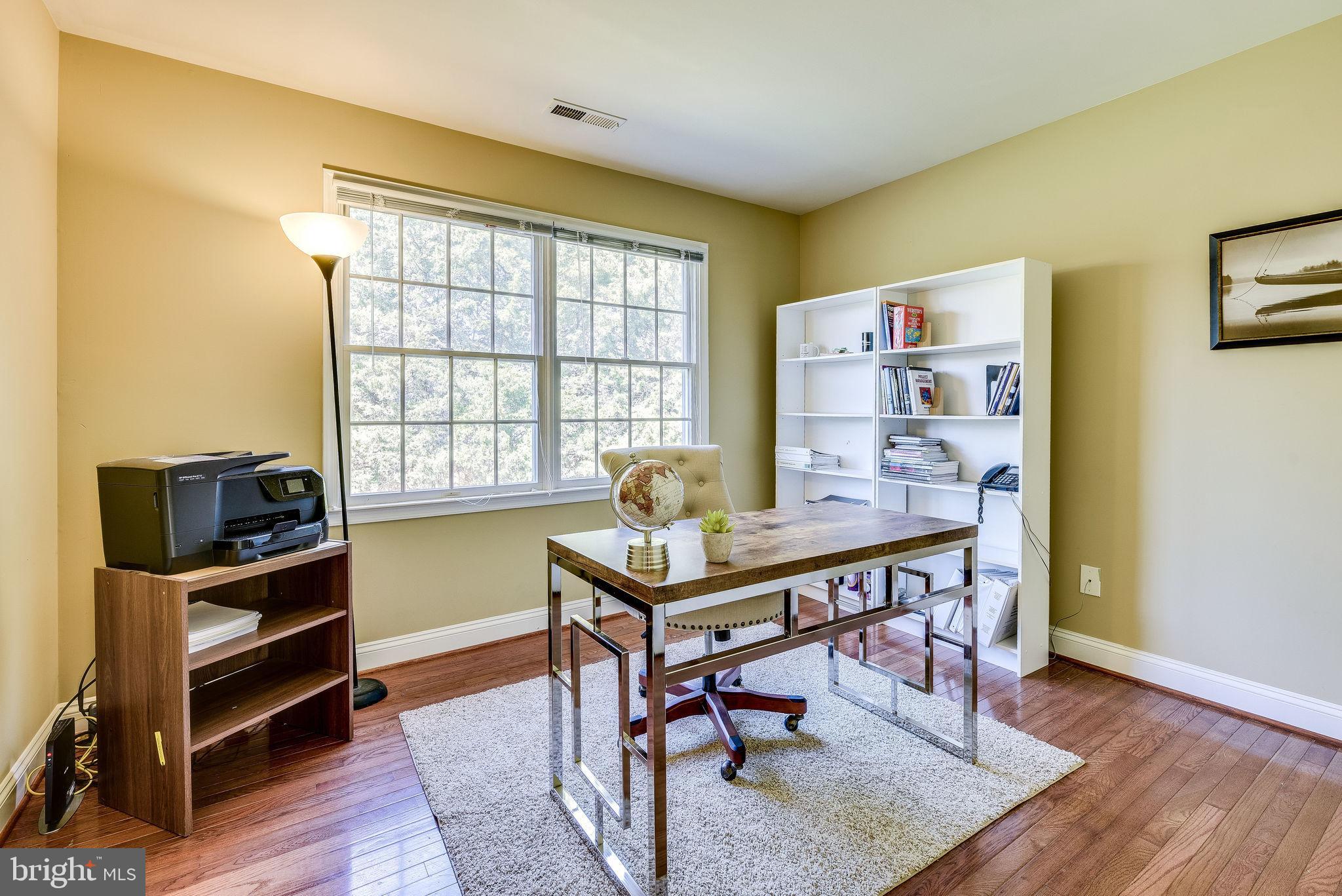 1701 Raleigh Hill Road Vienna, VA 22182 - Photo 47 of 61 a view of a workspace with furniture and a window