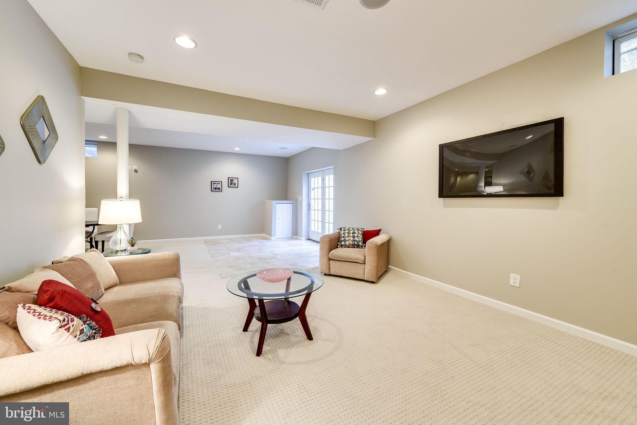 1701 Raleigh Hill Road Vienna, VA 22182 - Photo 53 of 61 a living room with furniture and a flat screen tv