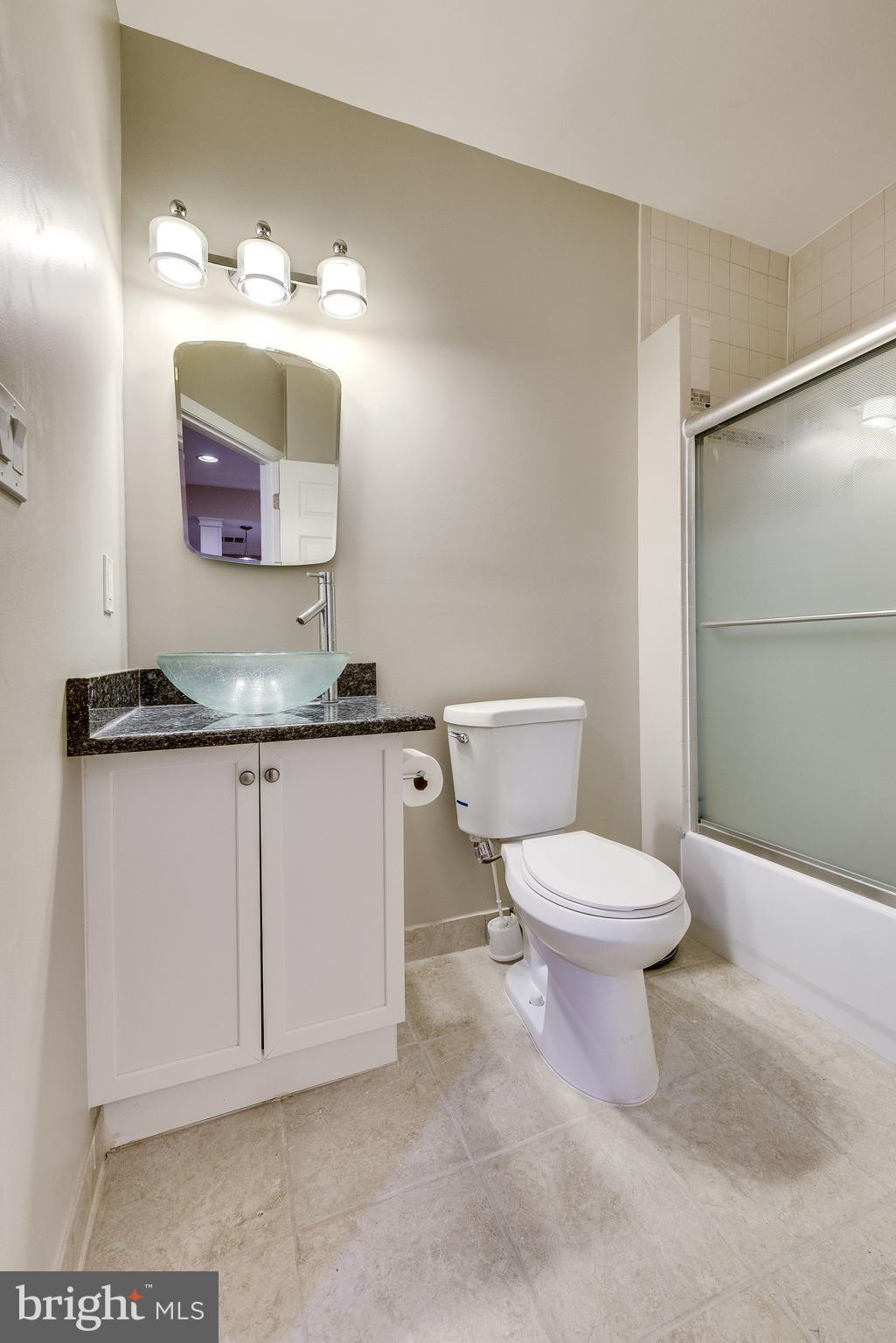 1701 Raleigh Hill Road Vienna, VA 22182 - Photo 58 of 61 a bathroom with a toilet sink and mirror