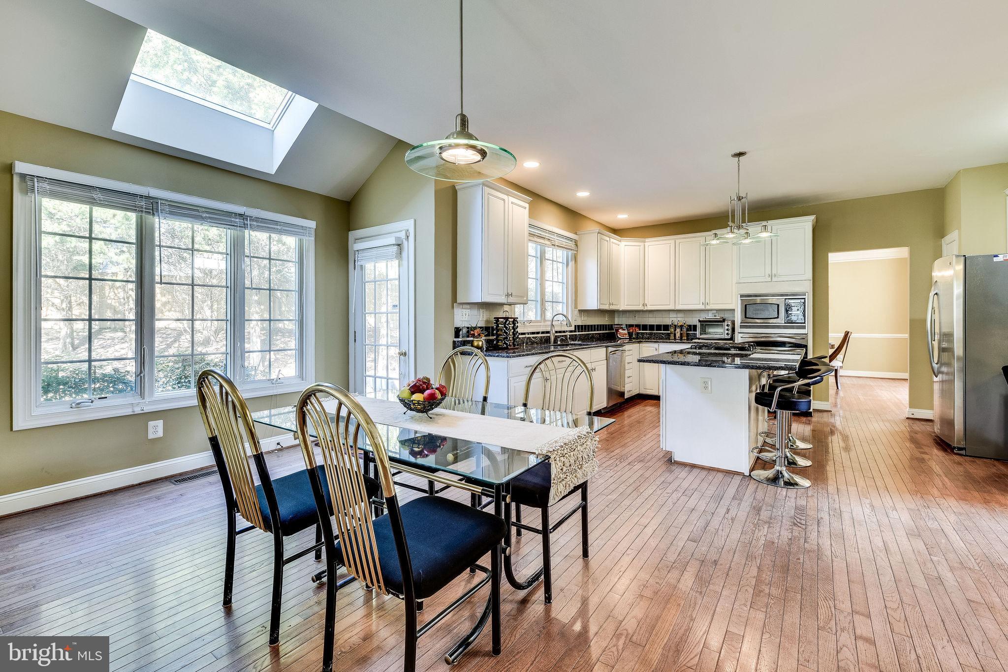 1701 Raleigh Hill Road Vienna, VA 22182 - Photo 9 of 61 a view of a dining room with furniture window and wooden floor