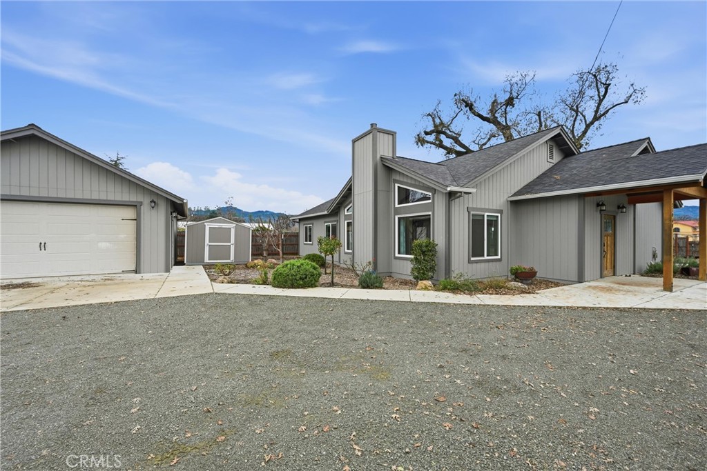 21060 Santa Clara Road Middletown, CA 95461 - Photo 1 of 21 a front view of a house with a yard and garage