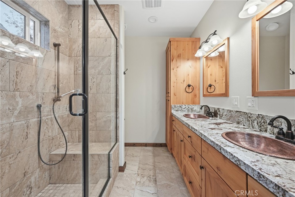 21060 Santa Clara Road Middletown, CA 95461 - Photo 12 of 21 a bathroom with a sink double vanity and a mirror