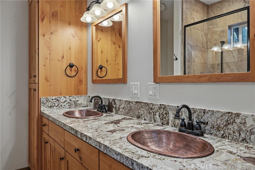 21060 Santa Clara Road Middletown, CA 95461 - Photo 13 of 21 a bathroom with a sink and a mirror