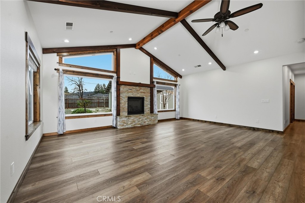 21060 Santa Clara Road Middletown, CA 95461 - Photo 2 of 21 a view of an empty room with a window and wooden floor