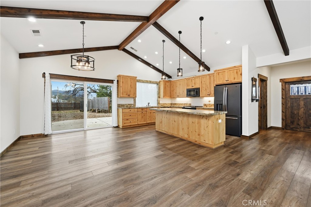 21060 Santa Clara Road Middletown, CA 95461 - Photo 3 of 21 a open kitchen with stainless steel appliances kitchen island granite countertop a stove and a refrigerator