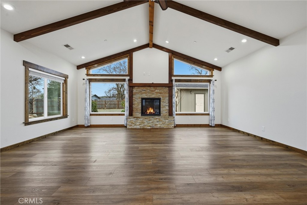 21060 Santa Clara Road Middletown, CA 95461 - Photo 4 of 21 a view of an empty room with wooden floor fireplace and a window