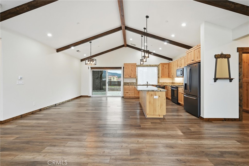 21060 Santa Clara Road Middletown, CA 95461 - Photo 5 of 21 a view of a kitchen with refrigerator and wooden floor