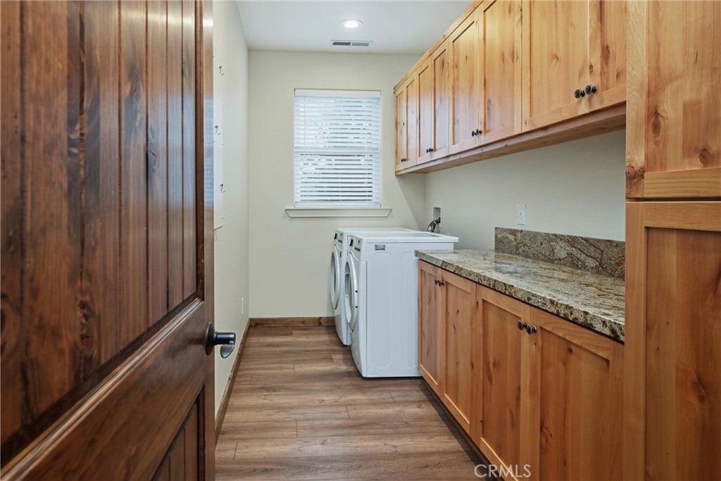 21060 Santa Clara Road Middletown, CA 95461 - Photo 9 of 21 a kitchen with granite countertop cabinets stainless steel appliances and wooden floor