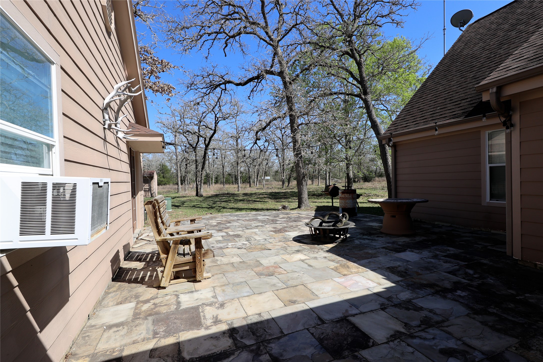 3337 Brunes Mill Road Columbus, TX 78934 - Photo 31 of 48 a view of a house with backyard and sitting area