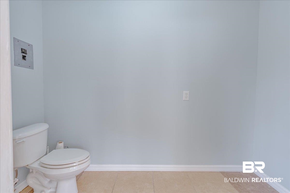 440 Dykes Road Mobile, AL 36608 - Photo 29 of 49 Bathroom with tile patterned floors, toilet, and baseboards