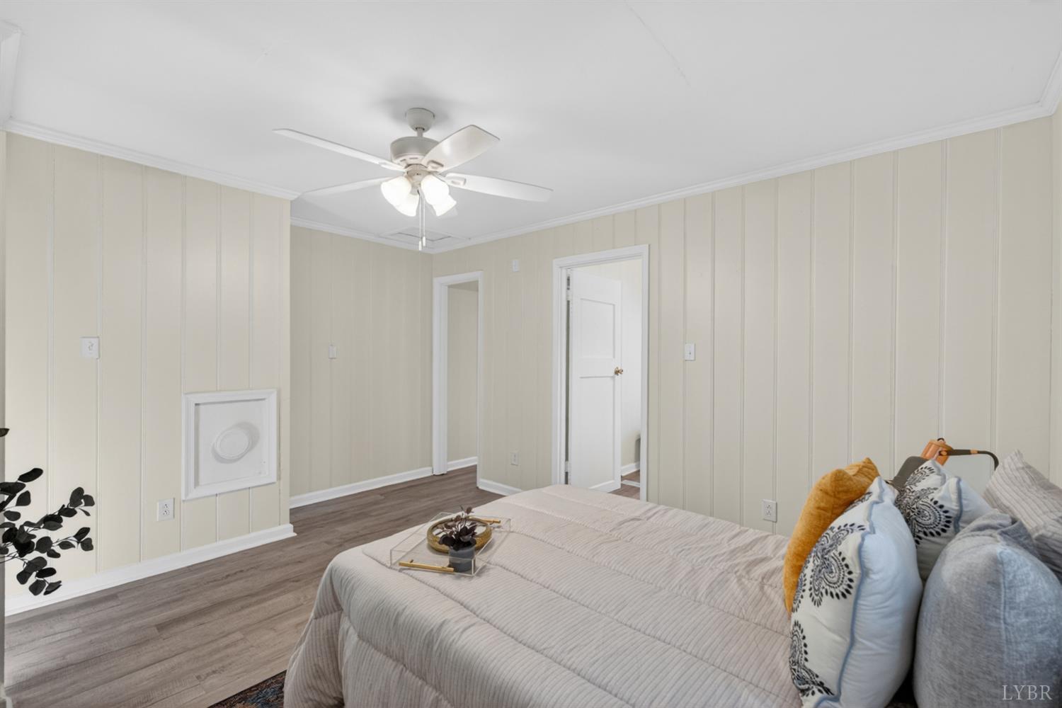 151 Brooks Street Monroe, VA 24574 - Photo 19 of 42 a bedroom with a bed and a chandelier fan