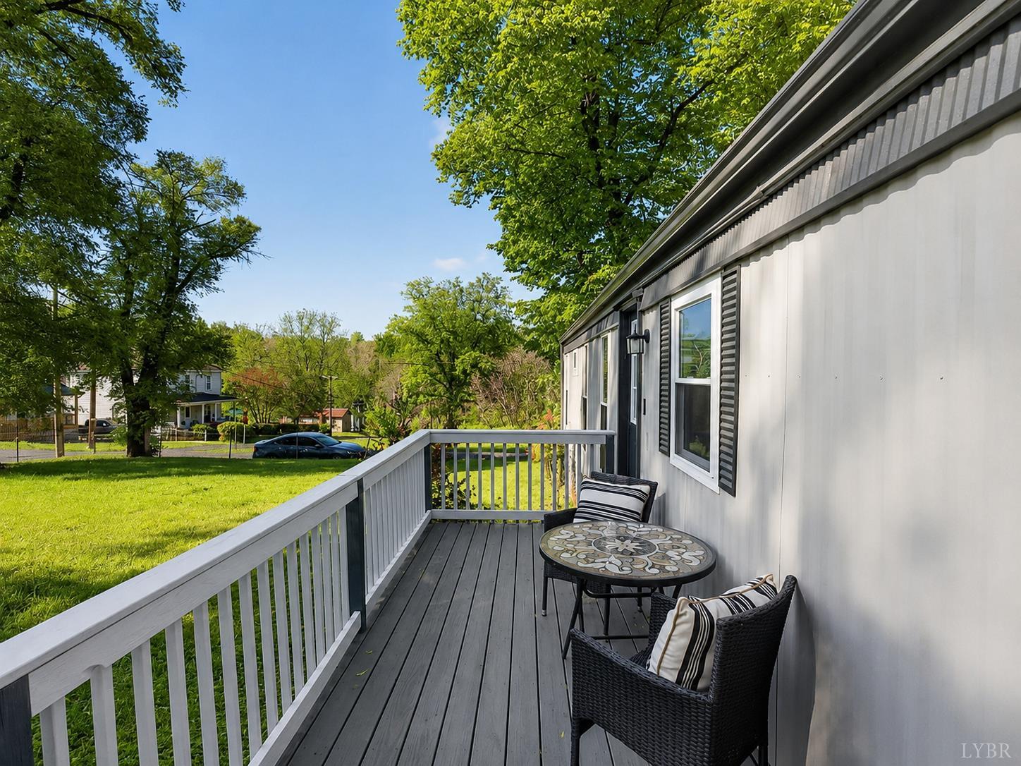 151 Brooks Street Monroe, VA 24574 - Photo 22 of 42 a view of a chair and table on the deck
