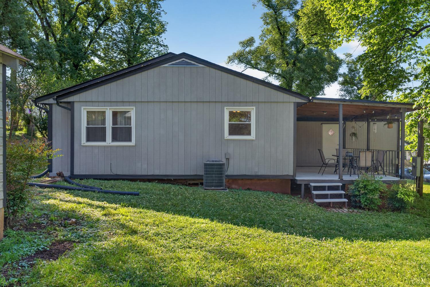 151 Brooks Street Monroe, VA 24574 - Photo 25 of 42 a view of a backyard with plants and large tree