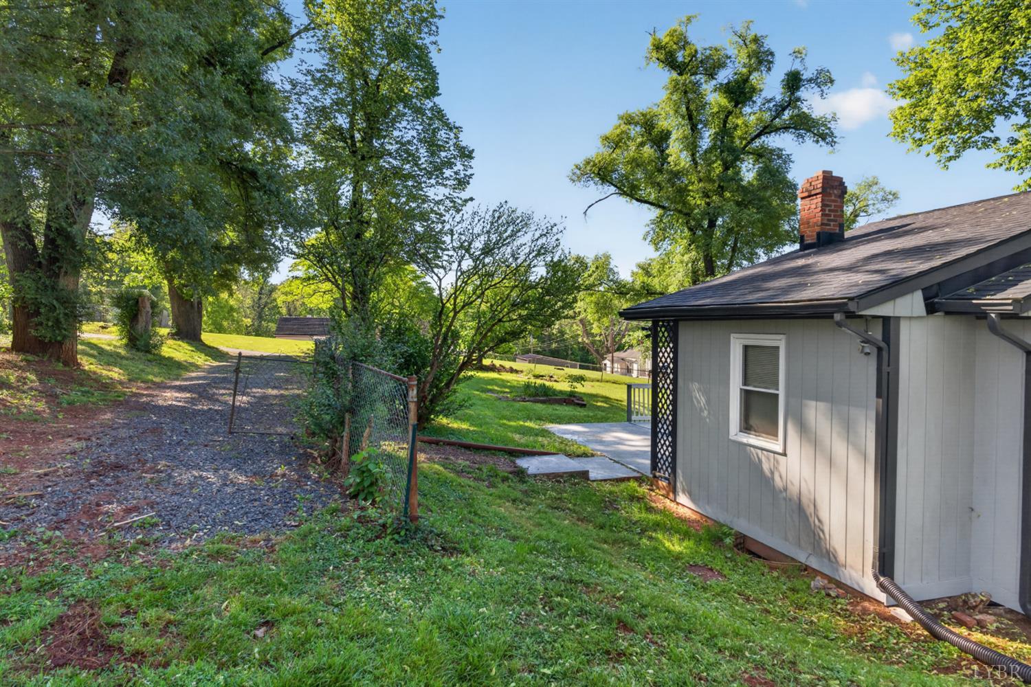 151 Brooks Street Monroe, VA 24574 - Photo 27 of 42 a view of a house with a backyard and a patio