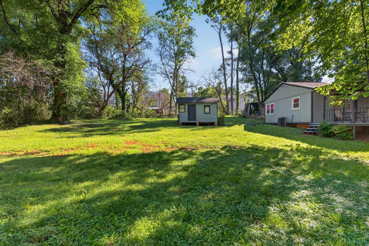 151 Brooks Street Monroe, VA 24574 - Photo 28 of 42 a view of a house with a yard and large trees