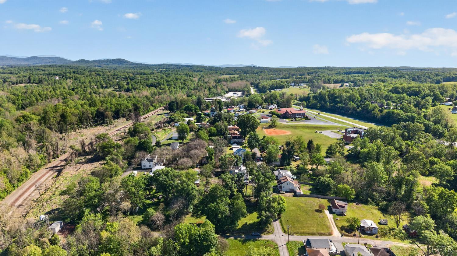 151 Brooks Street Monroe, VA 24574 - Photo 38 of 42 an aerial view of residential houses with outdoor space and trees