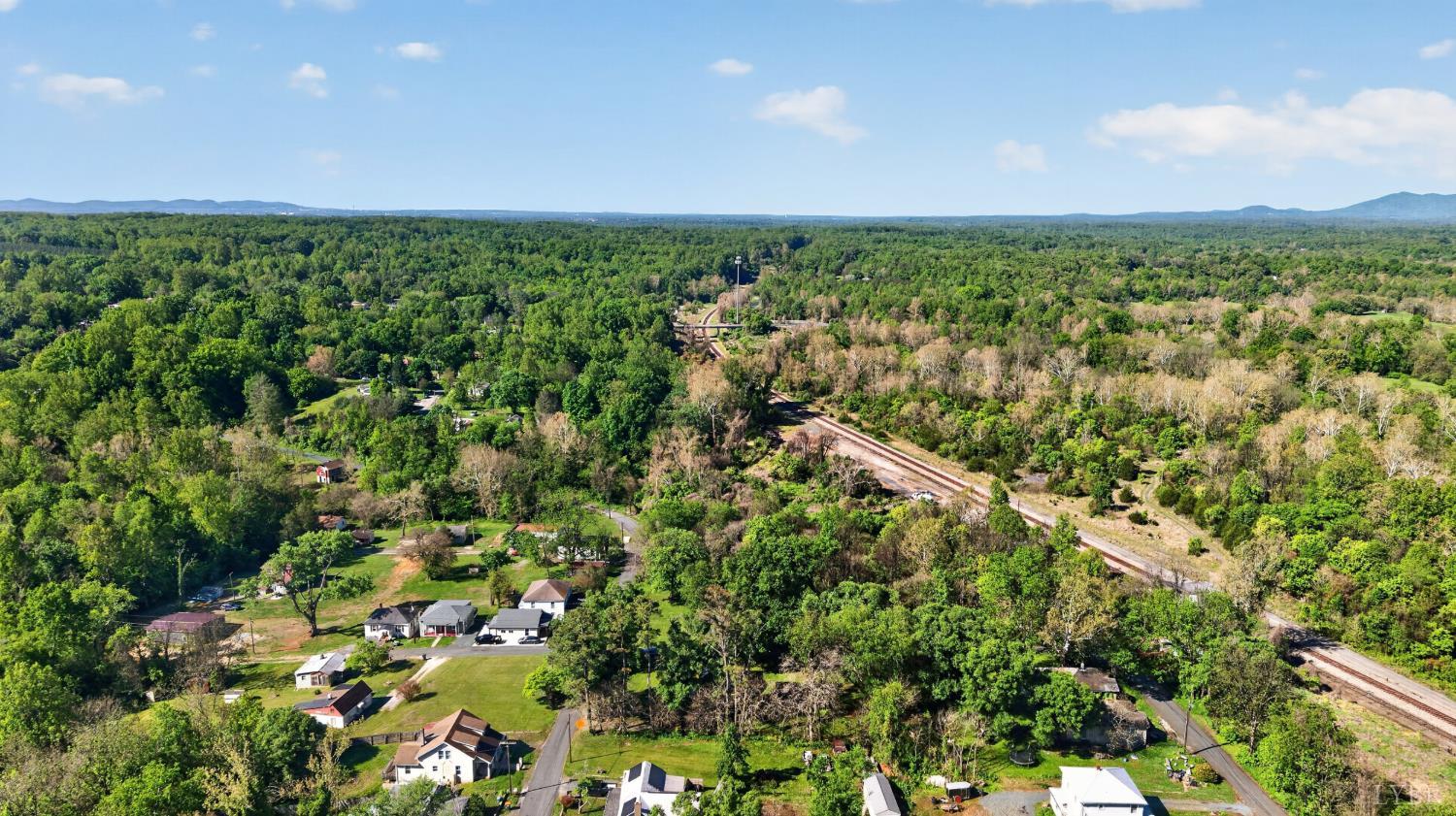 151 Brooks Street Monroe, VA 24574 - Photo 40 of 42 an aerial view of residential houses with outdoor space and trees
