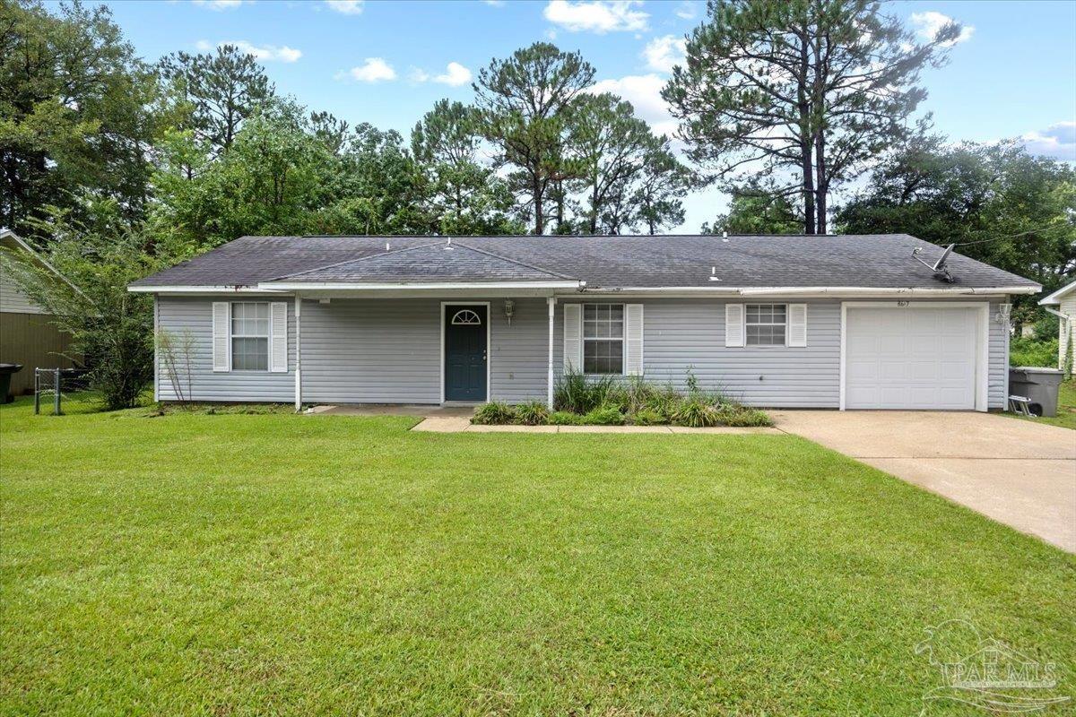8617 Blue Jay Way Pensacola, FL 32534 - Photo 1 of 28 a front view of a house with a garden