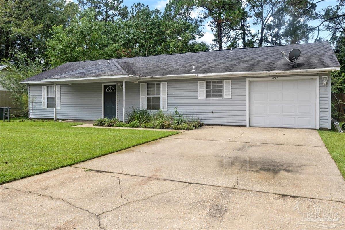 8617 Blue Jay Way Pensacola, FL 32534 - Photo 19 of 28 a view of a yard in front of a house with plants