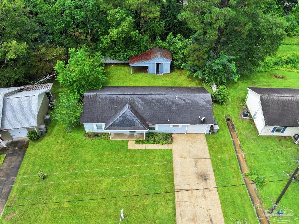 8617 Blue Jay Way Pensacola, FL 32534 - Photo 22 of 28 a view of house with backyard space and garden