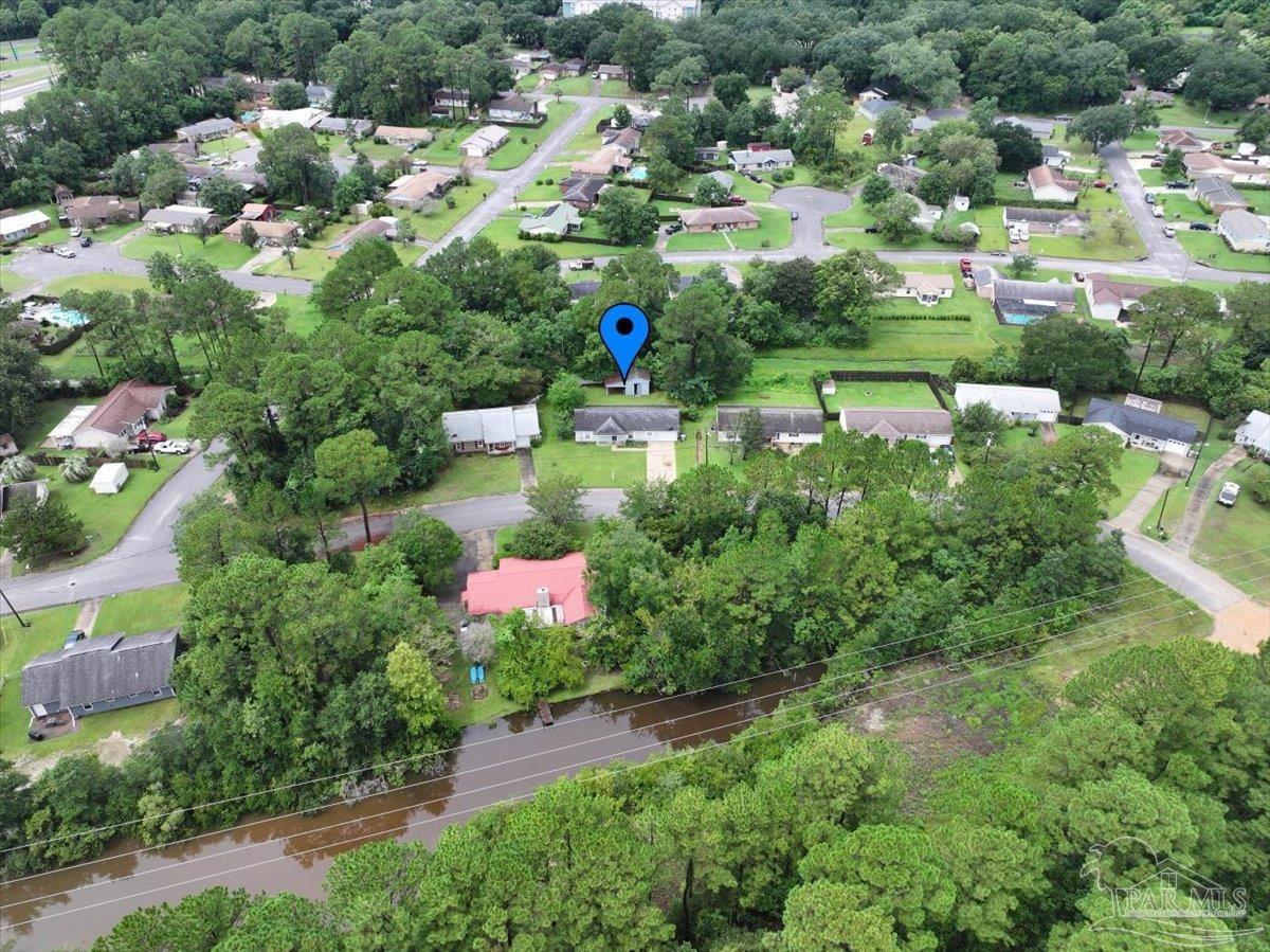 8617 Blue Jay Way Pensacola, FL 32534 - Photo 27 of 28 an aerial view of residential houses with outdoor space and trees all around