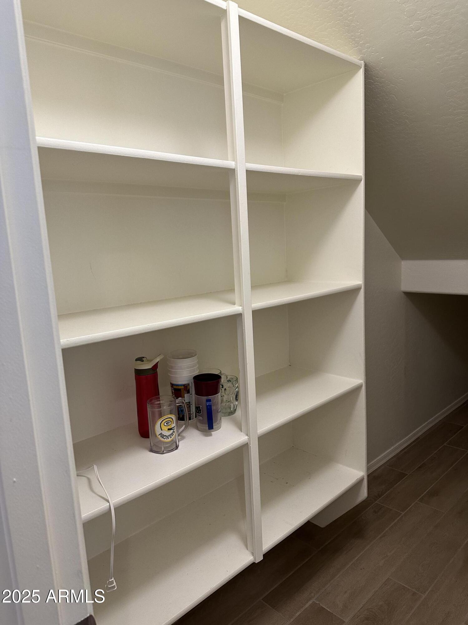 14870 West Encanto Boulevard, Unit 1113 Goodyear, AZ 85395 - Photo 16 of 33 a shelf with cup and plates