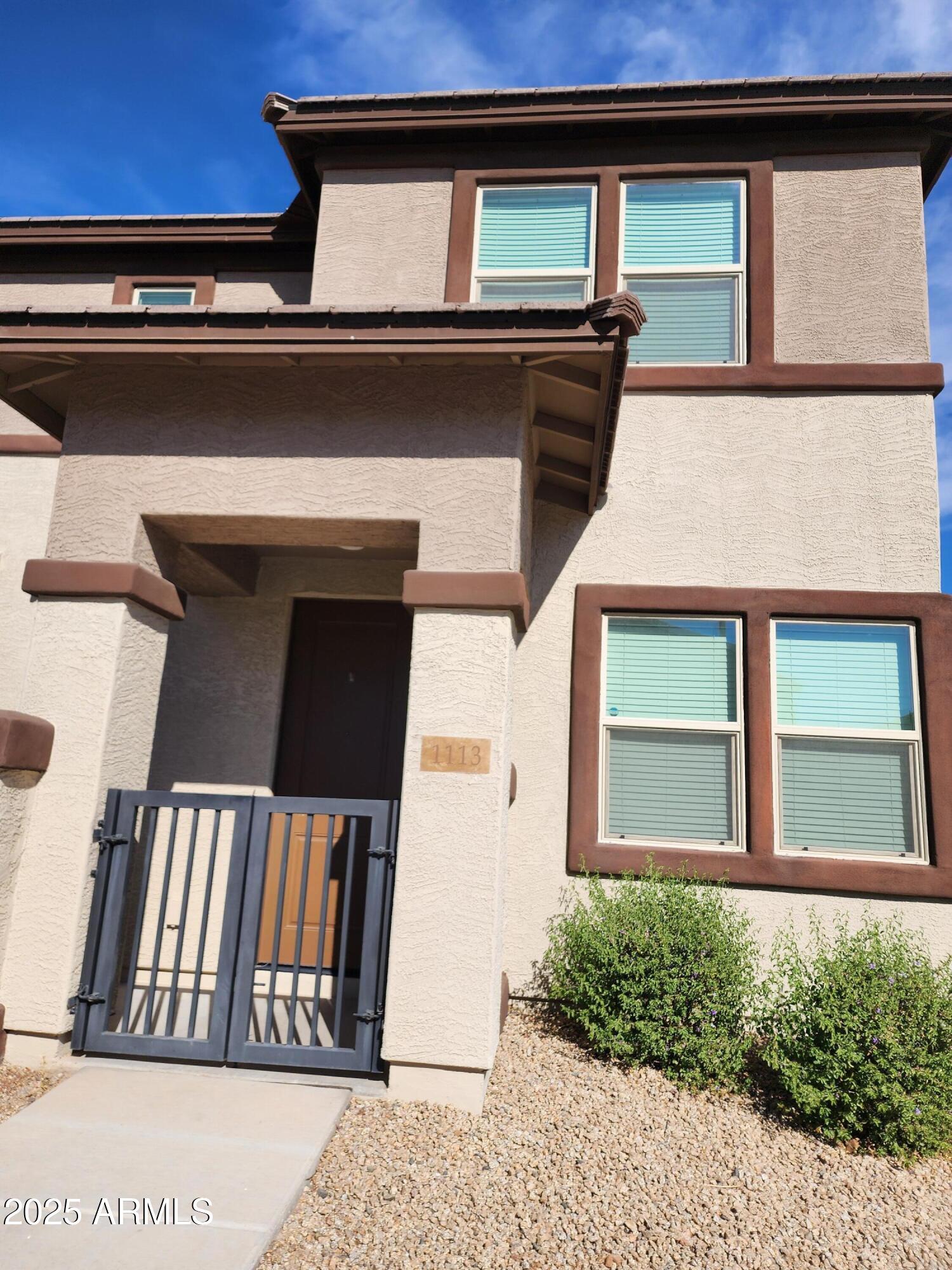 14870 West Encanto Boulevard, Unit 1113 Goodyear, AZ 85395 - Photo 4 of 33 a view of a building that has windows