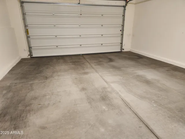 a bathroom with a granite countertop sink and a large mirror