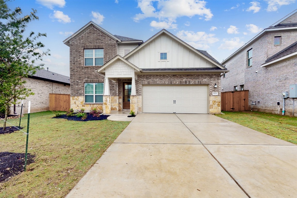 553 Cold Riv Run Kyle, TX 78640 - Photo 1 of 1 a front view of a house with a yard and garage