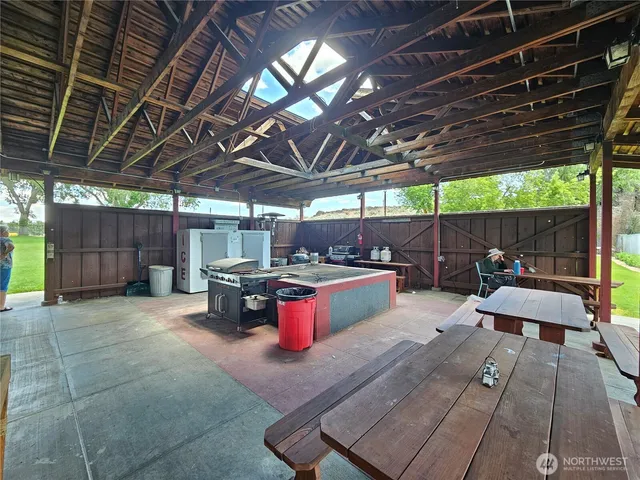 a kitchen with a sink appliances and cabinets